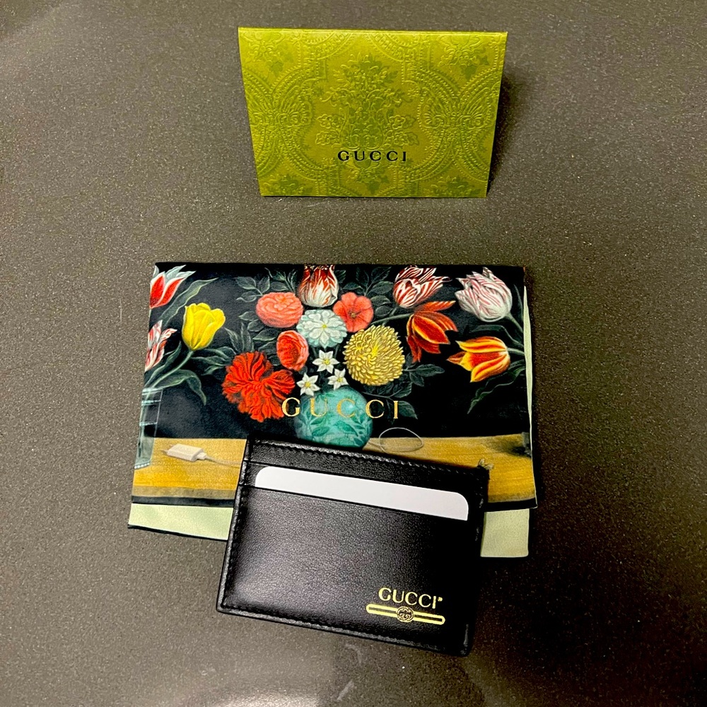Brand new with dust cover Gucci card case black with small gold logo